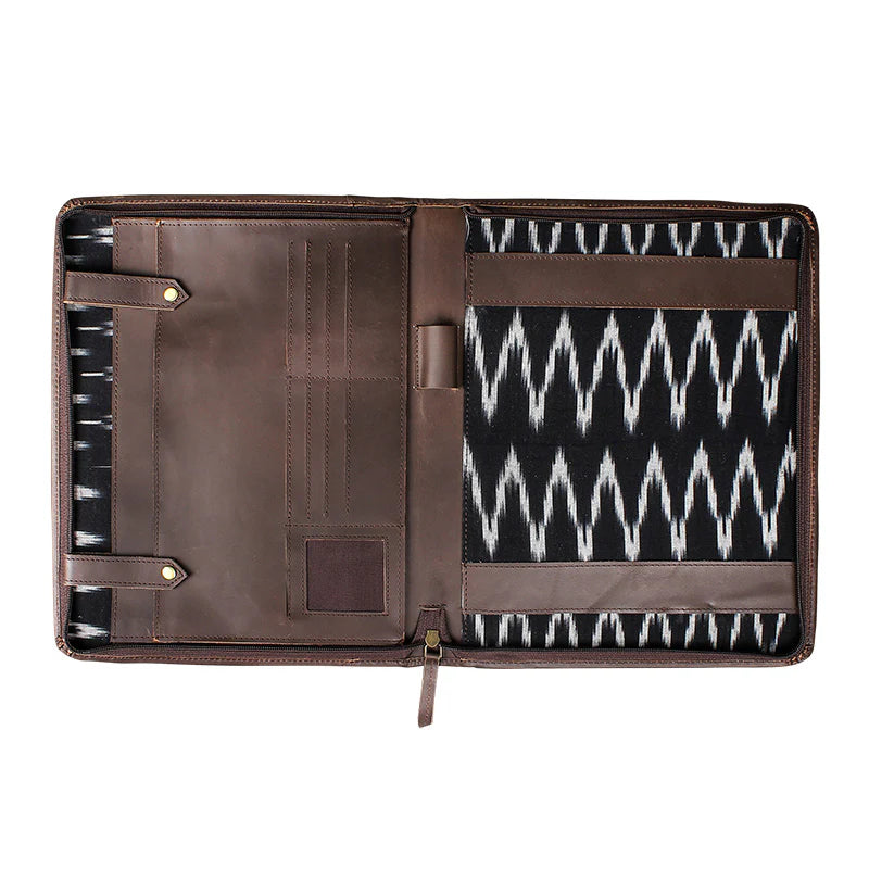 Brown leather portfolio with patterned interior on a white background