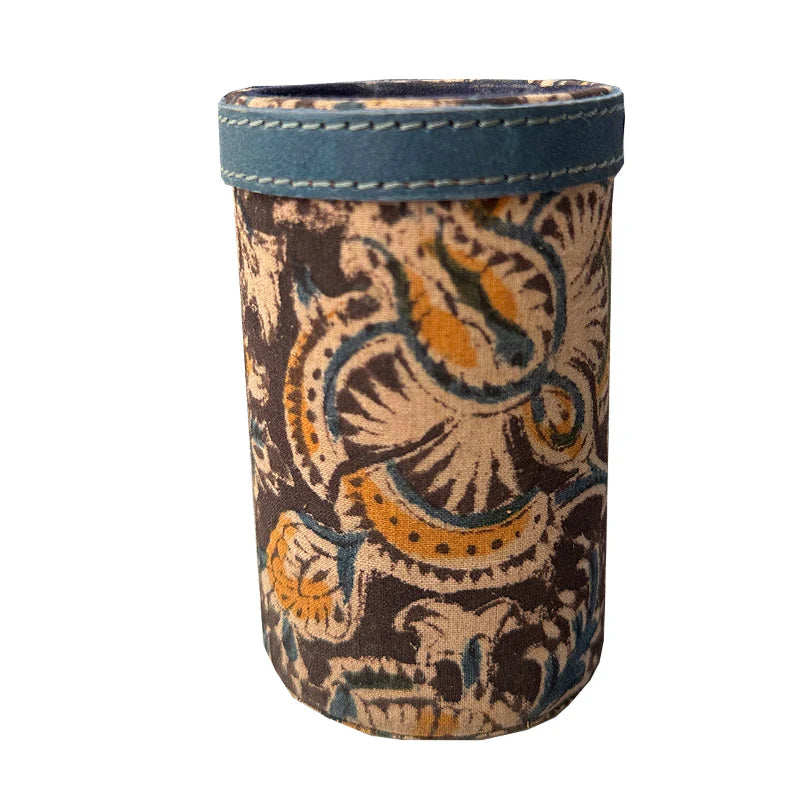Decorative cup sleeve with intricate patterns on a white background