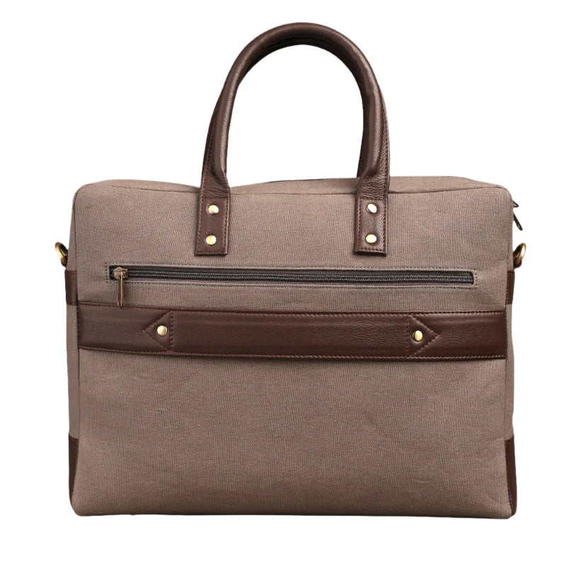 Brown travel bag with leather accents on a white background