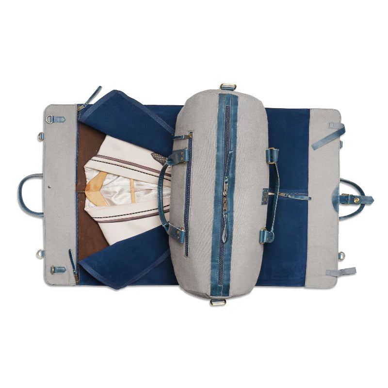 Open suitcase with clothing items on a white background