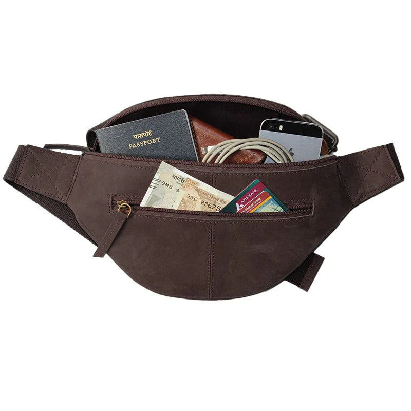 Brown waist bag with various items including a passport and cards on a white background