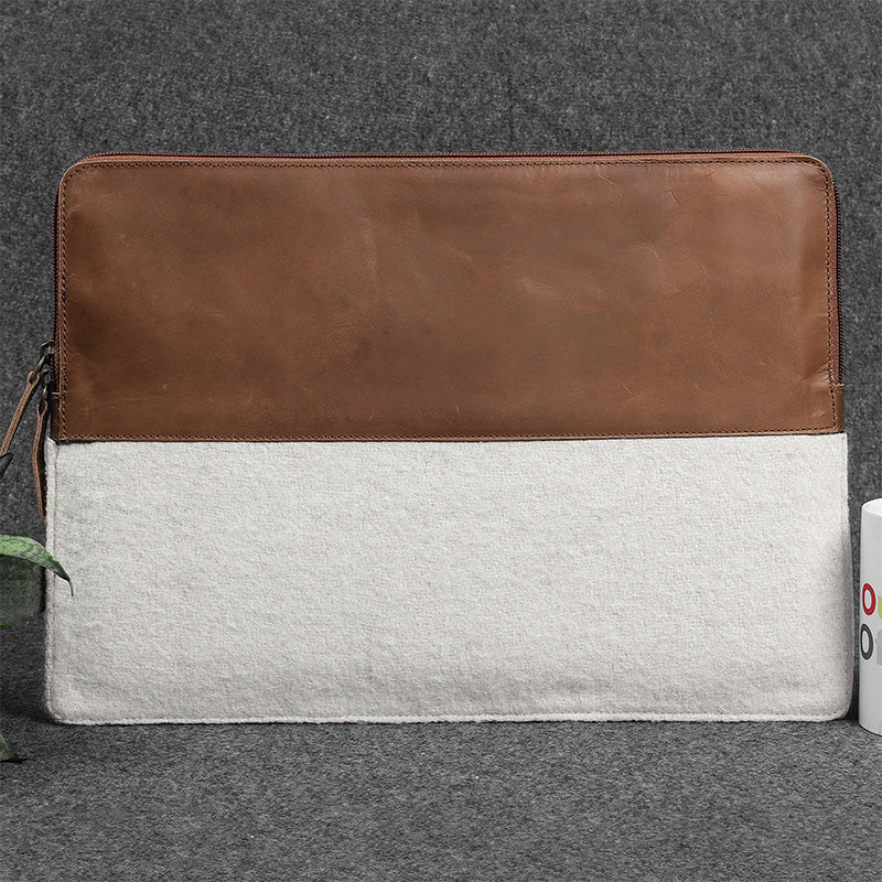 Two-tone brown and gray laptop sleeve on a gray background