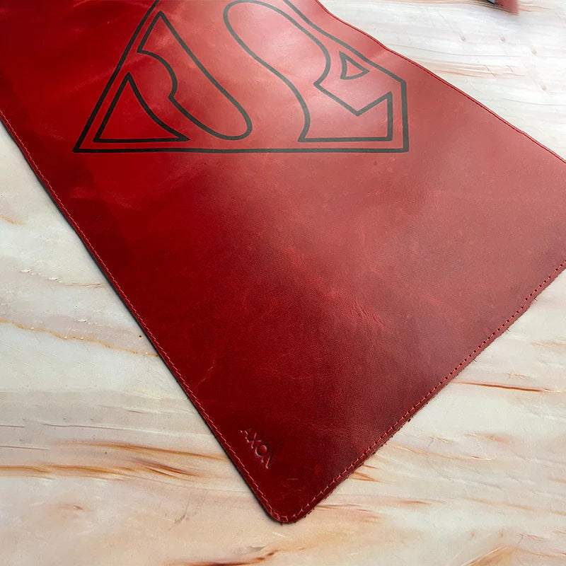 Red mat with a logo on a light wooden surface