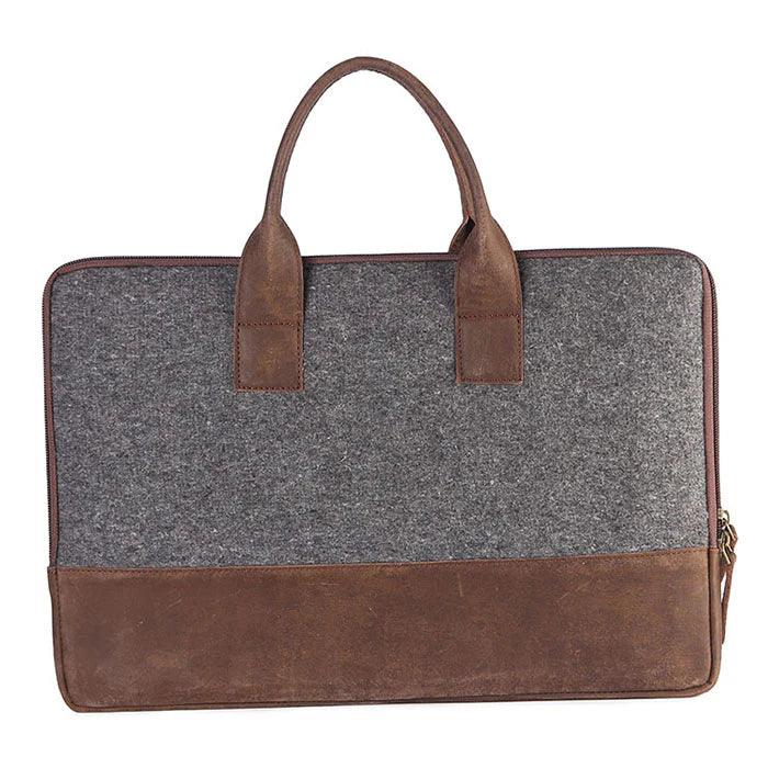 Gray bag with brown leather accents on a white background