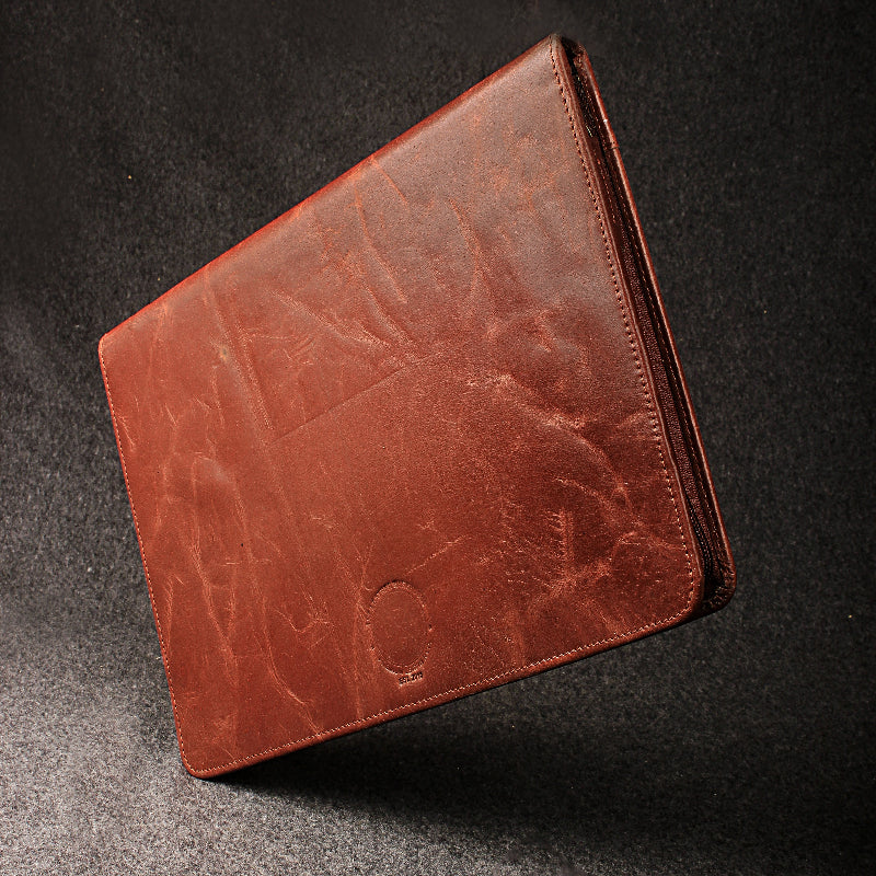 Brown leather wallet on a dark textured surface