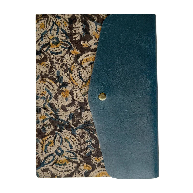 Blue leather clutch with floral patterned lining on a white background
