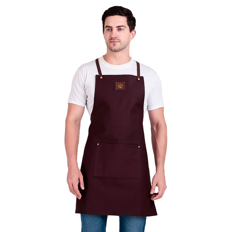 Man wearing a brown apron on a white background