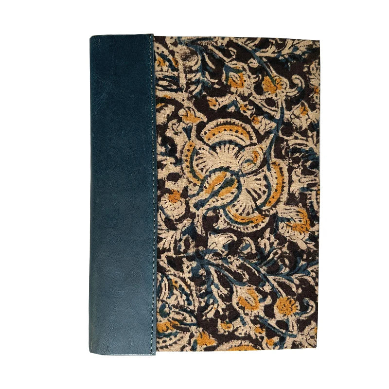 Notebook with blue leather cover and floral patterned back on a white background