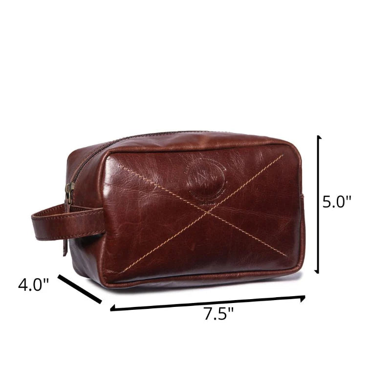 Brown leather toiletry bag with measurements on a white background
