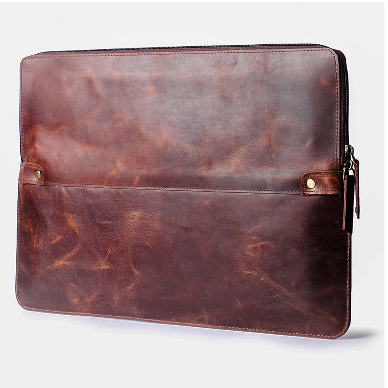 Brown leather laptop sleeve on a white background