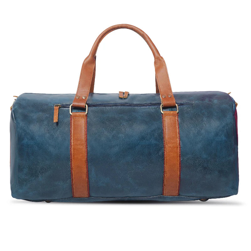 Blue duffel bag with brown leather straps on a white background