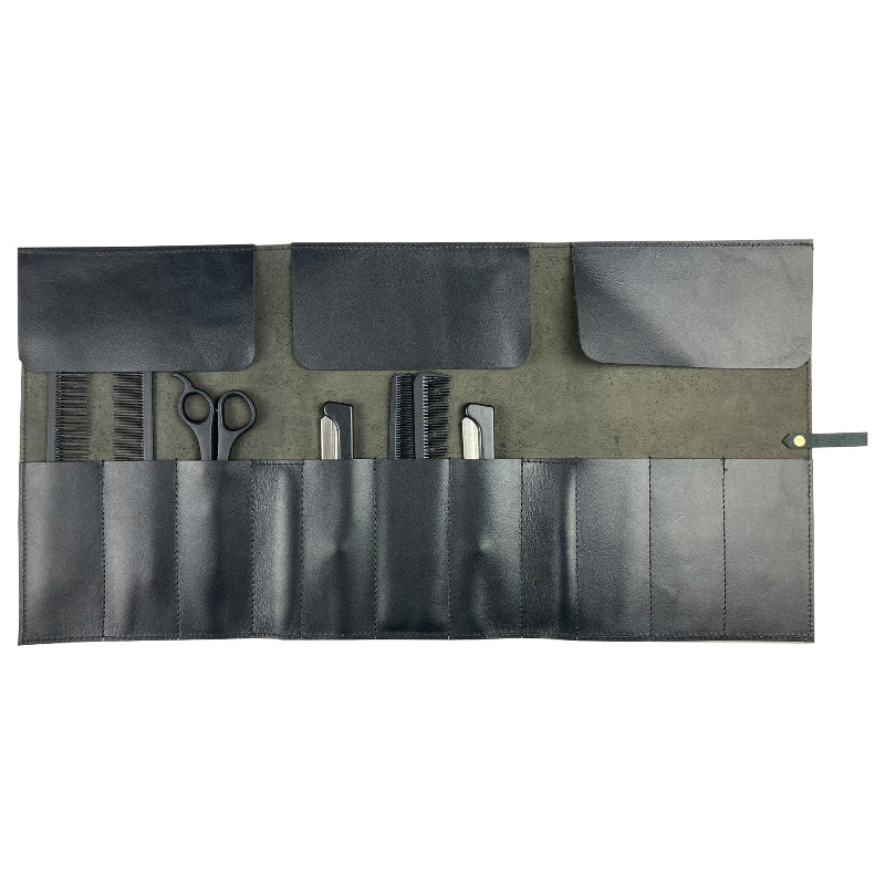 Set of grooming tools in a black and gray roll-up case on a white background