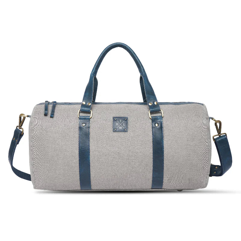 Gray duffel bag with blue straps on a white background