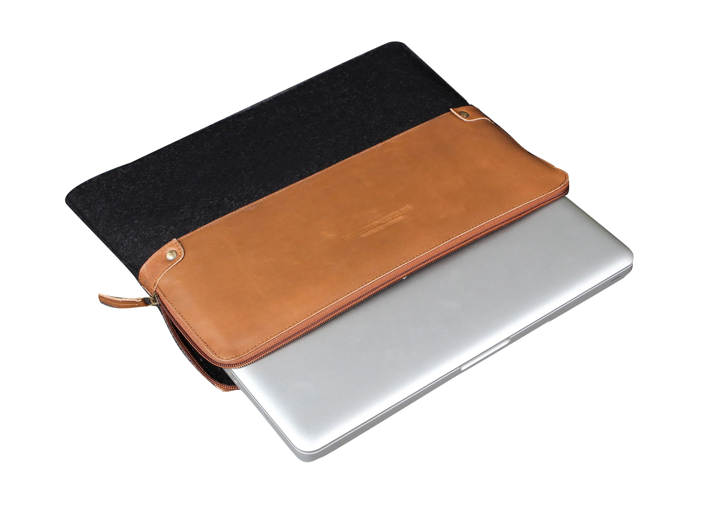 Laptop with a black and brown leather sleeve on a white background