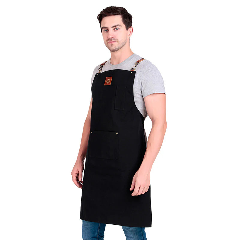 Man wearing a black apron on a white background
