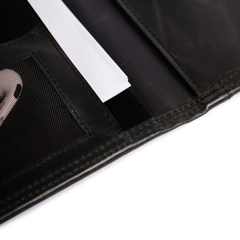 Close-up of a black wallet with a card holder on a white background