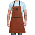 Person wearing a brown apron on a white background