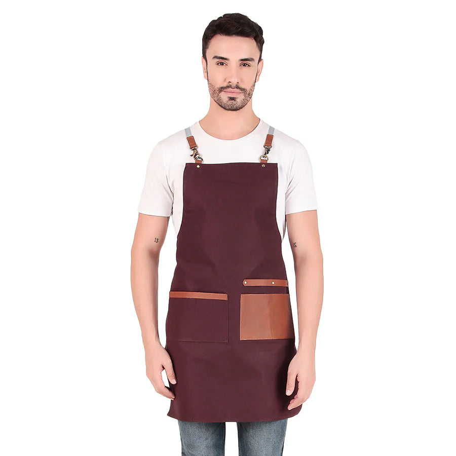 Man wearing a maroon apron with brown accents on a white background
