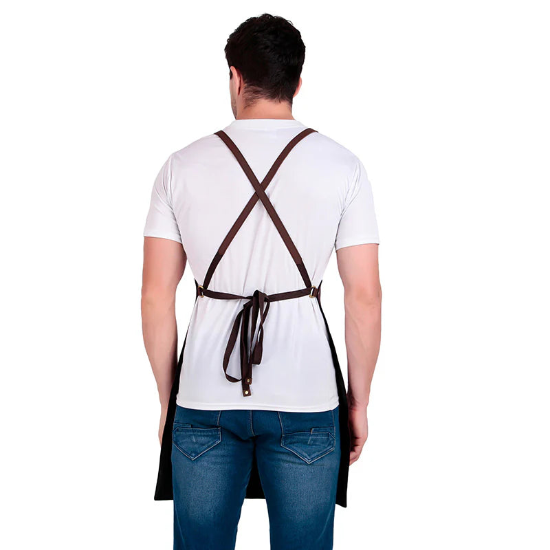 Person wearing a white shirt and blue jeans with a brown apron over their shoulders on a white background