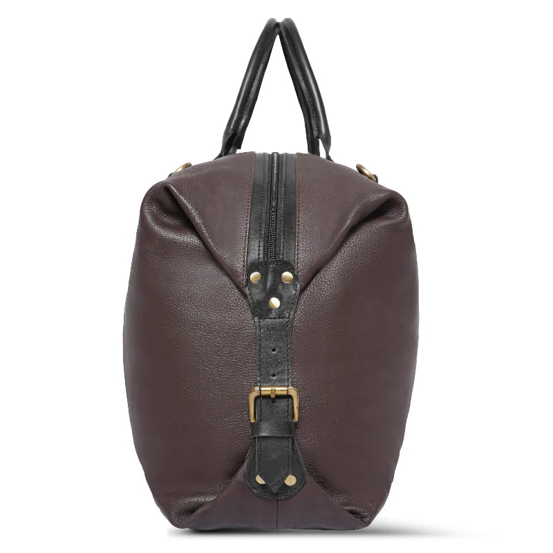 Brown leather handbag with black straps on a white background