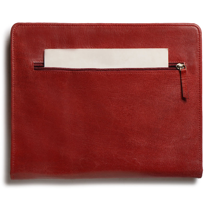 Red leather pouch with a white card inside on a white background