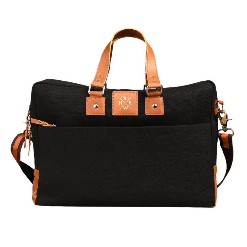 Black bag with brown leather straps and accents on a white background