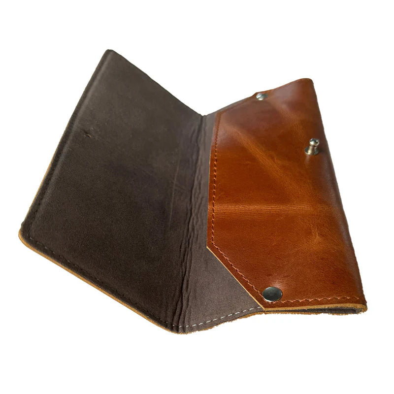 Two-tone leather wallet with brown and black sections on a white background