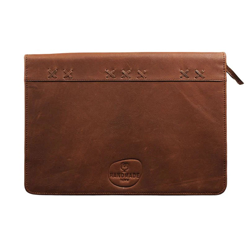 Brown leather pouch with stitching details on a white background