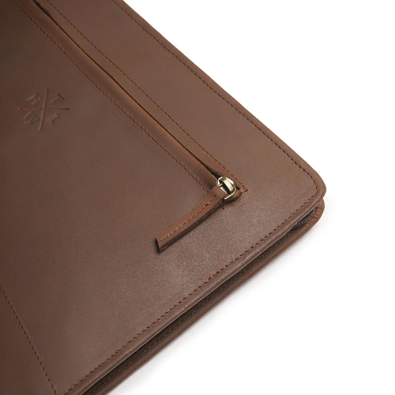 Brown leather case with a strap on a white background