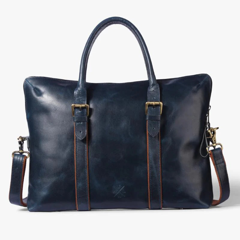 Blue leather bag with gold hardware on a white background