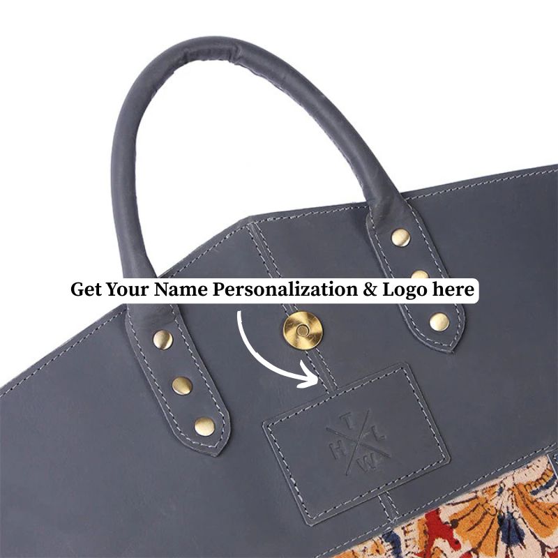 Gray garment bag with decorative handle and visible brand logo on a white background