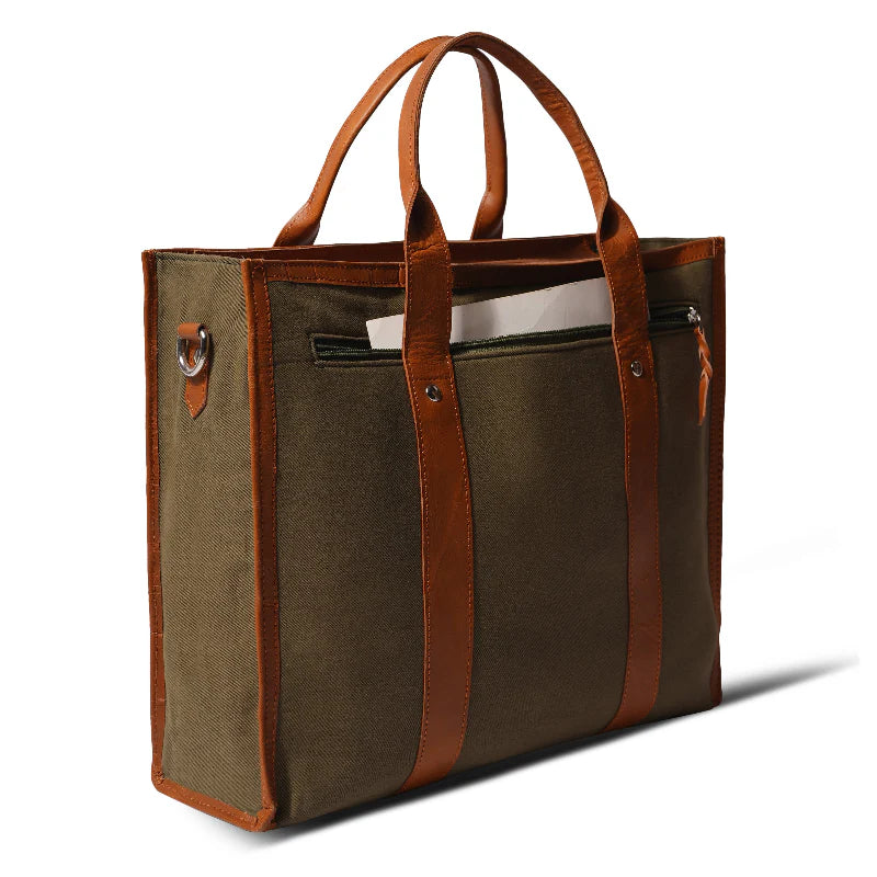 Brown tote bag with leather accents on a white background