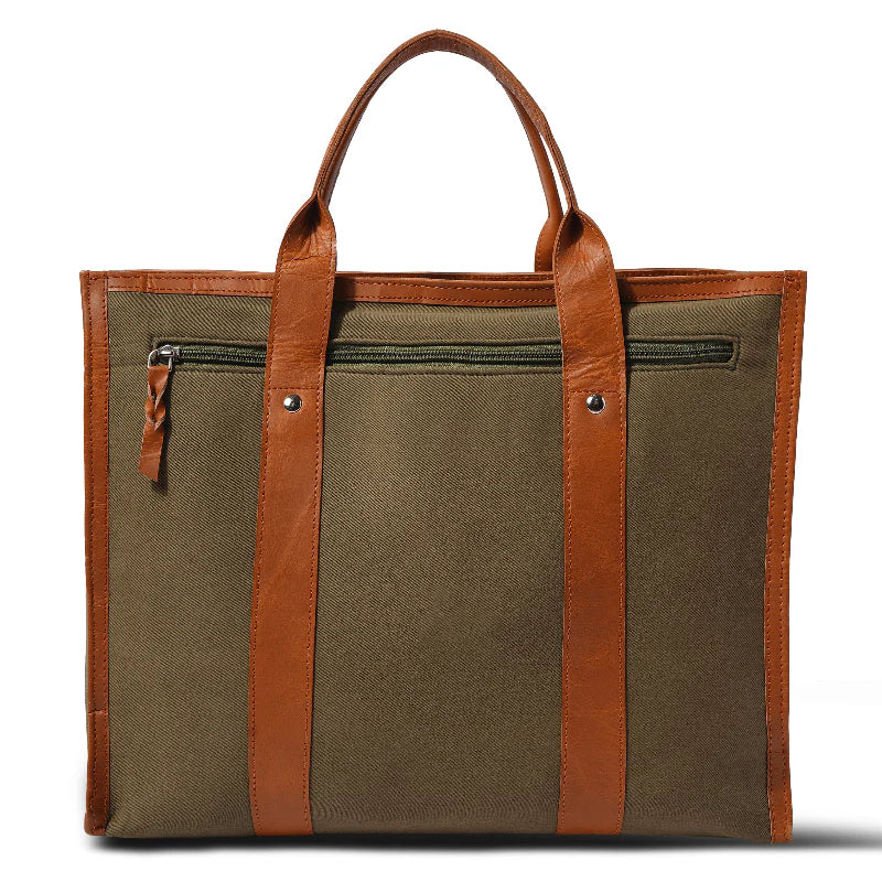 Green tote bag with brown leather straps on a white background