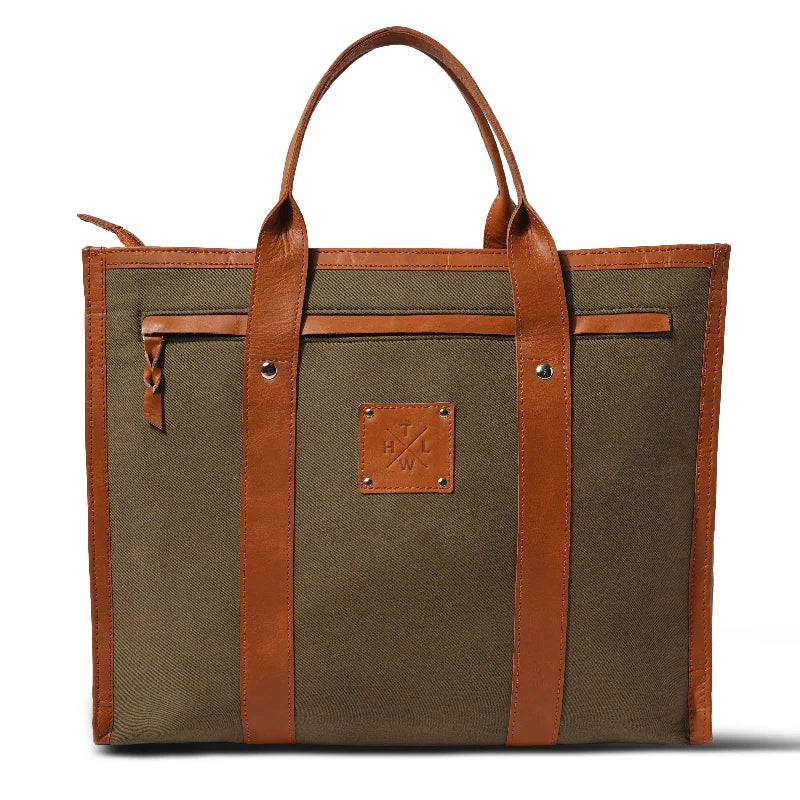 Brown tote bag with leather straps on a white background