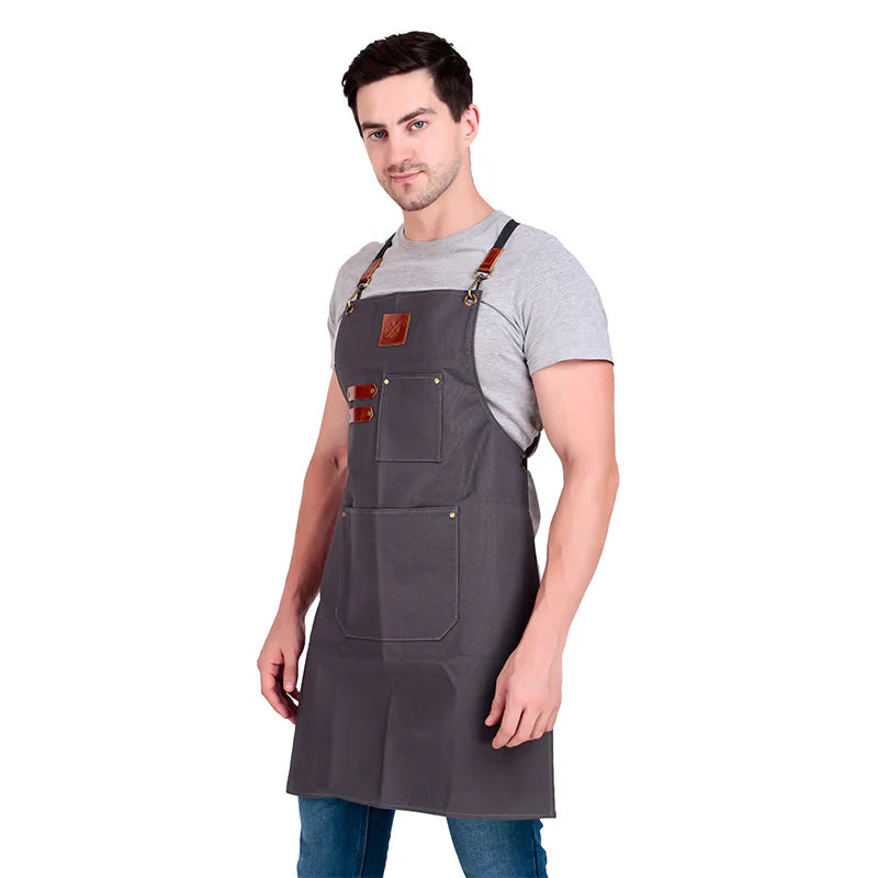 Man wearing a gray apron on a white background