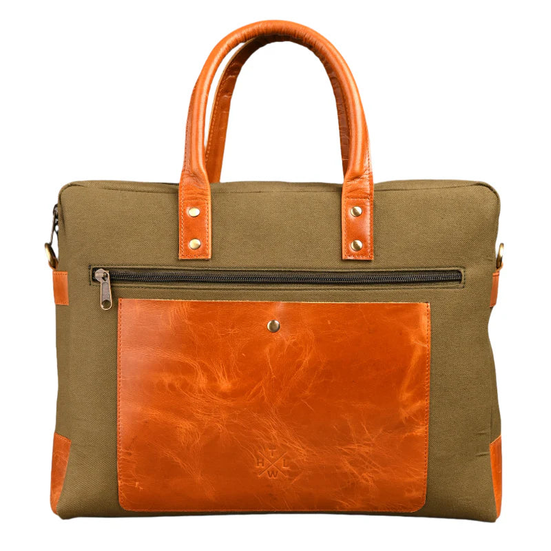 Green and brown tote bag with leather accents on a white background