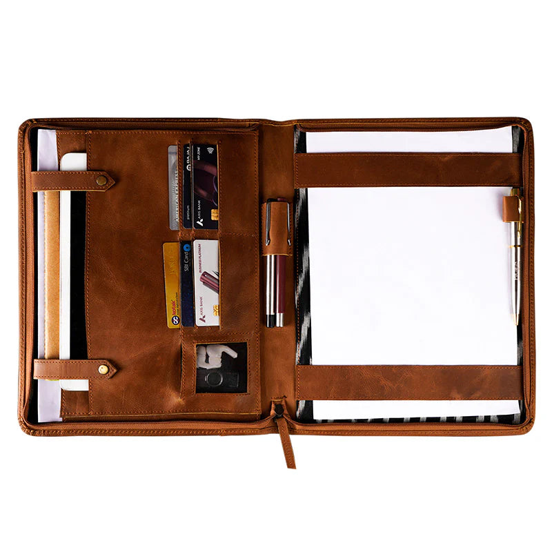 Brown leather organizer with compartments on a white background