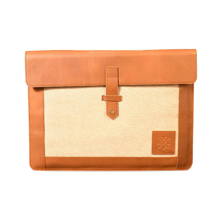 Brown leather and beige fabric pouch with a visible brand logo on a white background