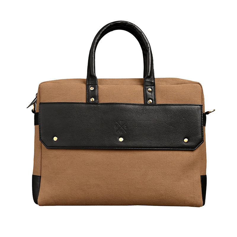 Brown and black handbag with gold studs on a white background