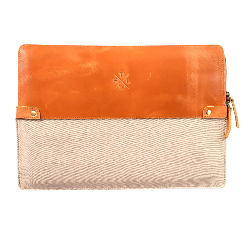 Two-tone orange and beige clutch bag on a white background
