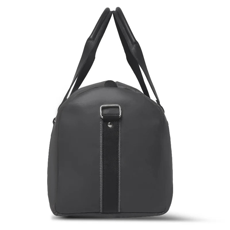 Black duffel bag with black straps on a white background