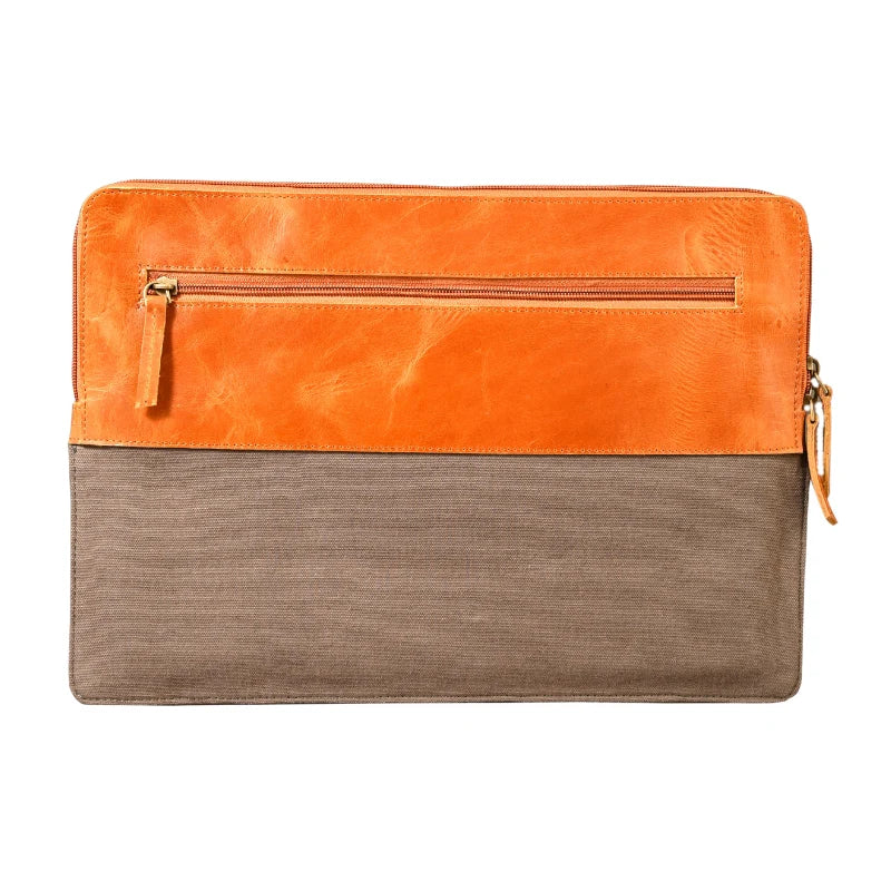 Two-tone orange and brown leather clutch bag on a white background