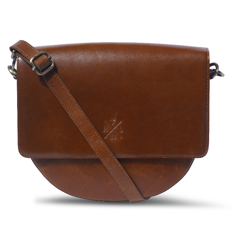 Brown leather crossbody bag on a white background