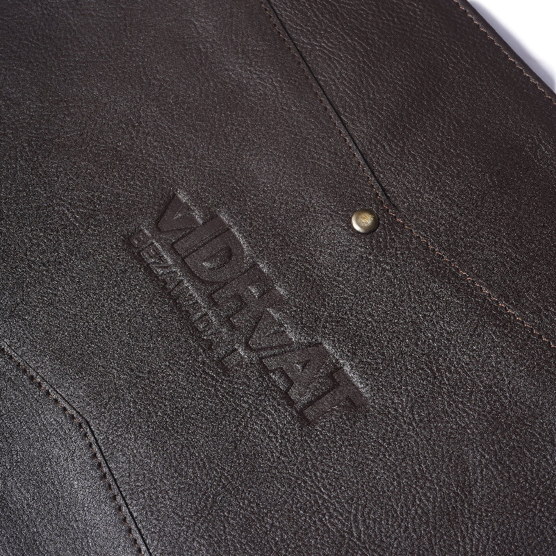 Close-up of a dark brown leather product with &
