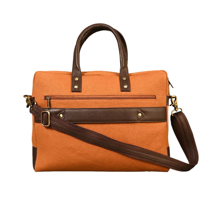 Orange bag with brown leather straps on a white background