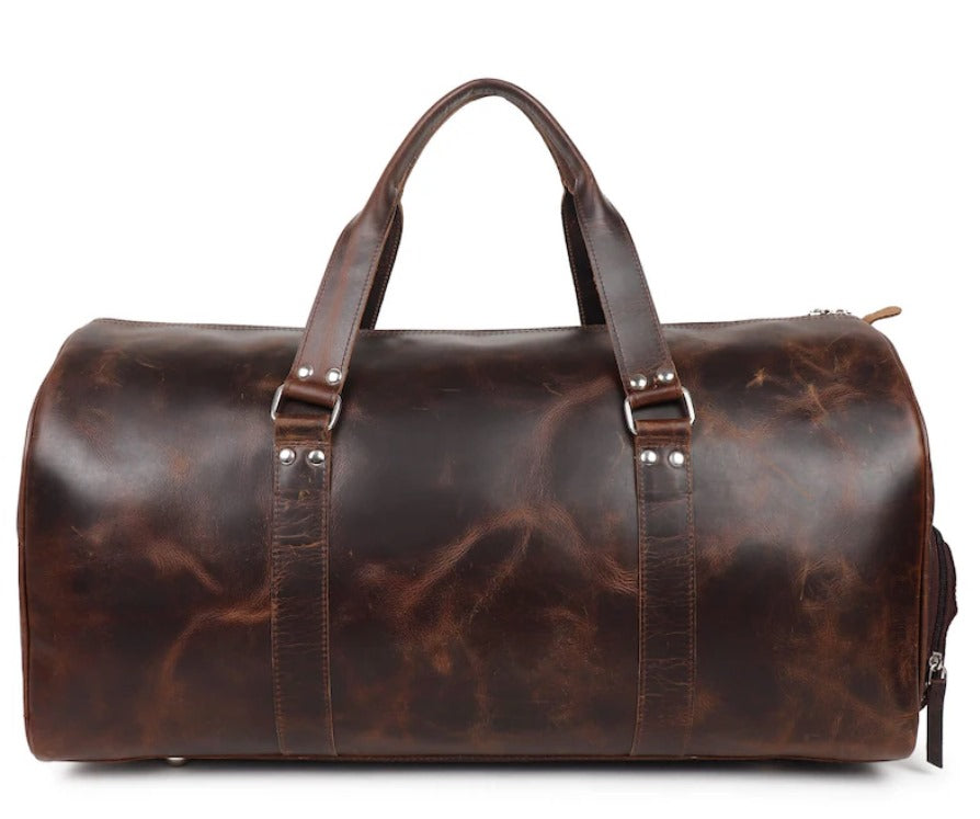 Brown leather duffel bag on a white background