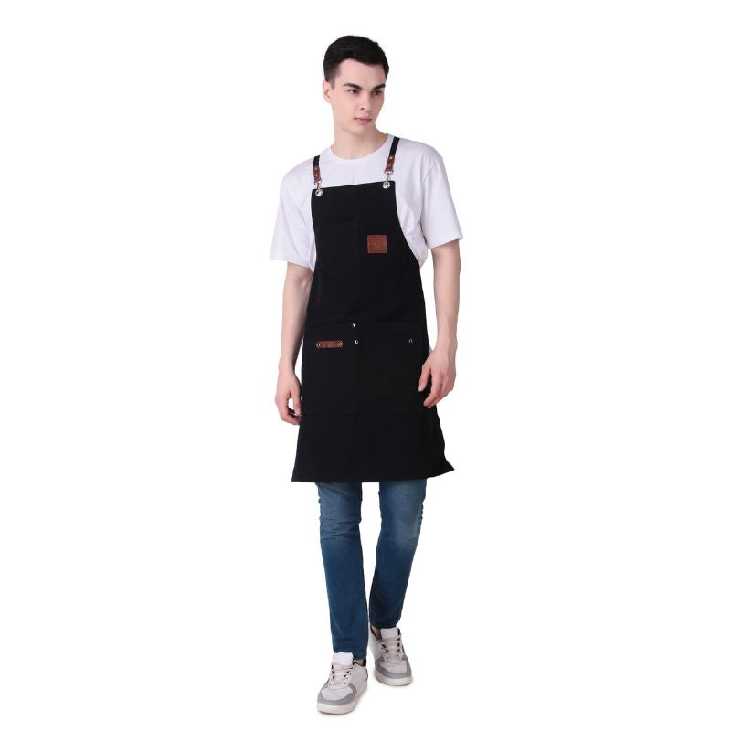 Person wearing a black apron on a white background
