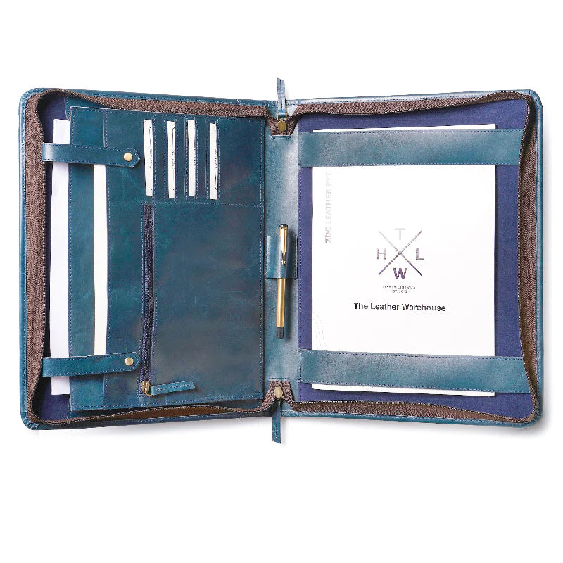 Open blue leather folio with pen holder and card slots, featuring 'The Leather Warehouse' branding.