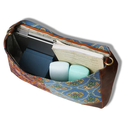 Patterned pouch with stationery items on a white background