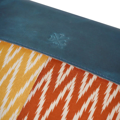 Close-up of a colorful patterned product with a blue border and a logo.